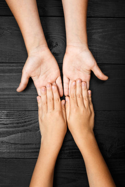 istock arms stretches out and holds one another 1277269145