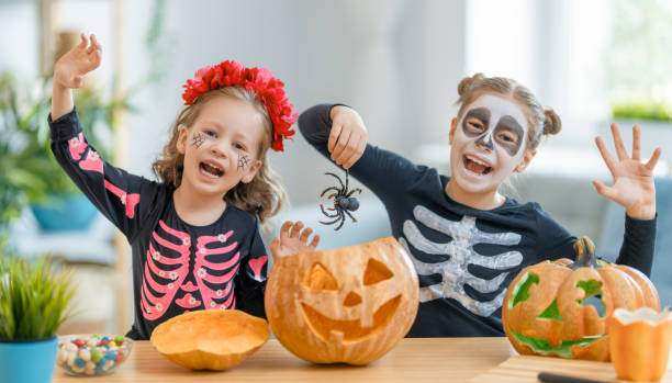 istock Happy family preparing for Halloween. 1277274372