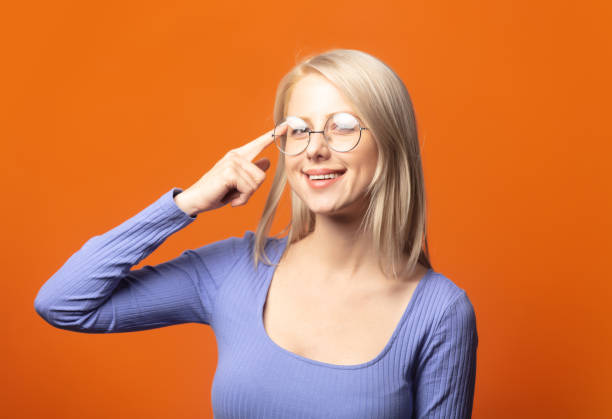 istock Cute blonde in blue blouse and glasses 1277277092