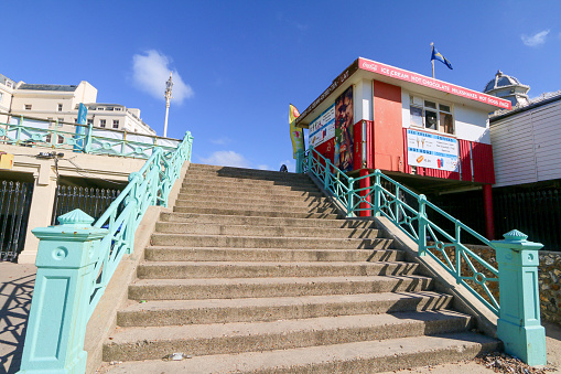 Stairs leading up to an ice cream parlor on Brighton Beach in East Sussex, England
