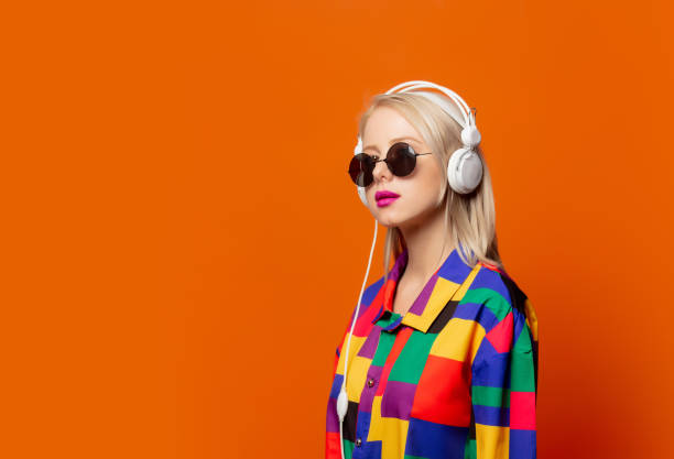 istock Style blonde in 90s clothes with headphones 1277278507