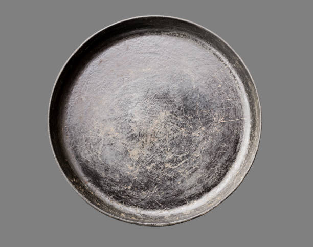 istock Old black cast iron Frying pan isolated on grey background top view close-up 1277278586