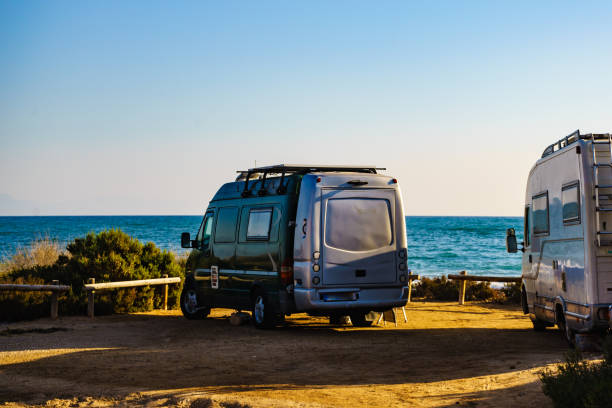 istock Camper cars on beach, camping on nature 1277278649