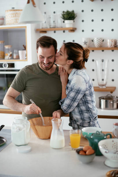 istock Young couple making pancakes at home 1277279528
