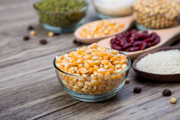 istock Corn in blow on a wood table background. corn seeds in blow 1277279653