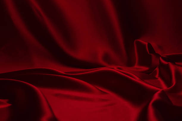 istock Red silk or satin luxury fabric texture can use as abstract background. 1277280828