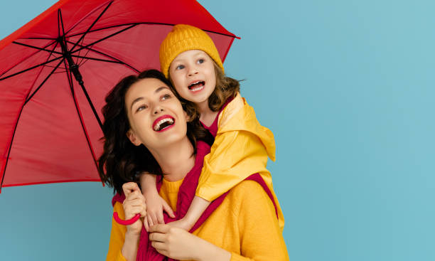 istock Family with red umbrella 1277280851