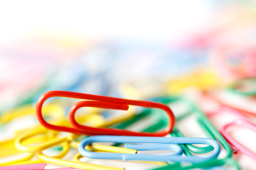 Close-up of multi-colored paper clips. Shallow depth of field.