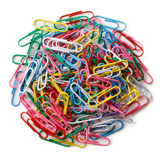 istock Heap of multi colored paper clips isolated on a white background 1277282136