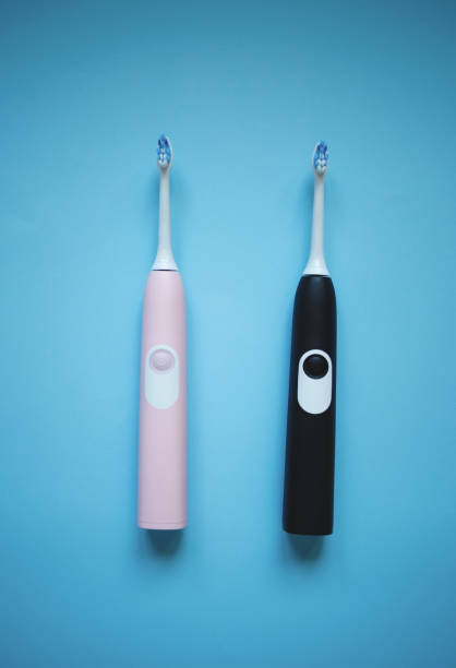 istock two ultrasonic electric toothbrushes on a blue background 1277283726