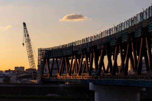 istock A steel bridge under construction, a crane and an interestingly shaped cloud 1277284142