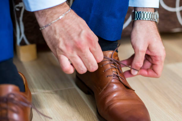istock Business man knot shoe lace indoor 1277285635