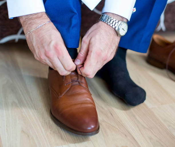istock Business man knot shoe lace indoor 1277285655