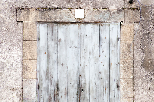 Old wooden front door  closed for a long time. Galicia, Spain. Rural depopulation.