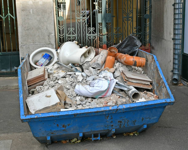 istock Large industrial garbage can full of trash 1277288723