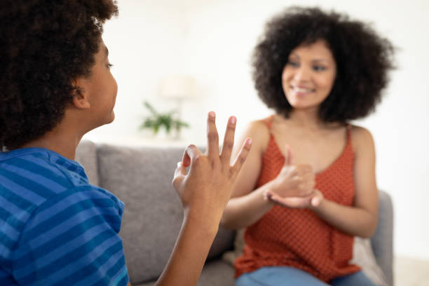 istock Mother and son communicating with each other in sign language 1277288799