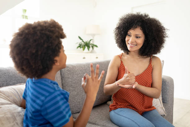 istock Mother and son communicating with each other in sign language 1277288803