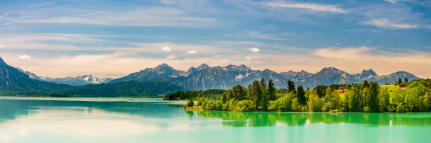 istock panoramic landscape in Bavaria with mountain range and lake 1277292930