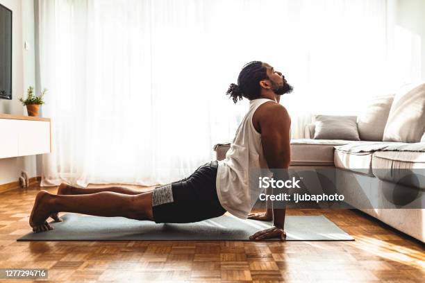 Taking A Moment To Breathe Stock Photo - Download Image Now - Yoga, Men, Exercising