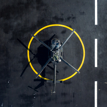 Military helicopter at helipad