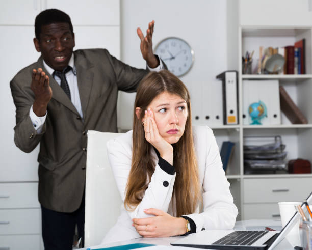istock Upset woman with angry boss 1277295757