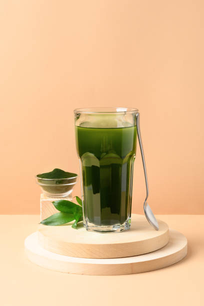 istock Chlorella healthy beverage in glass on a grey background. 1277296561
