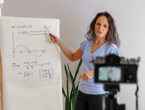 One young female professor holding online class for e-learning students during coronavirus pandemic period.