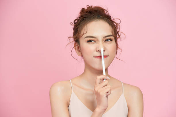 istock Applying eye makeup products on woman's face.  Perfect face makeup process. 1277297658