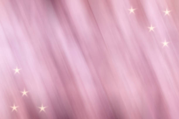 Abstract shining background and texture. Glowing light lines of bright colors against a dark background. Graphic digital image