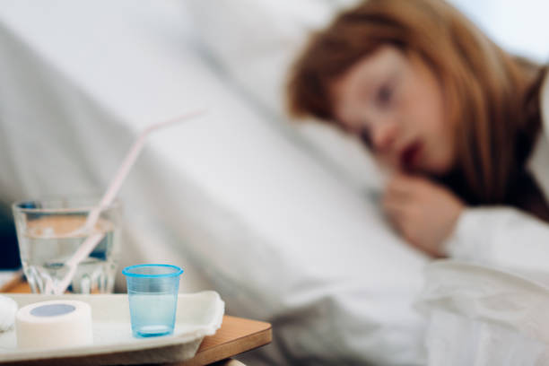 istock Drinking glass on table by patient in ward 1277298785