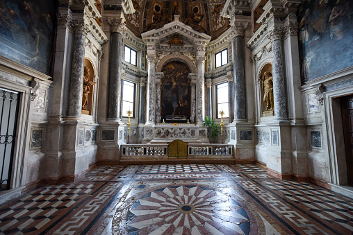 Interior of the gothic church San Zanipolo (Basilica di Santi Giovanni e Paolo). The actual church building proges was startet in 1333 and completed in 1430. The funeral services of all of Venice's doges were held in that church. The image was captured during the worldwide coronavirus epidemic (COVID19).