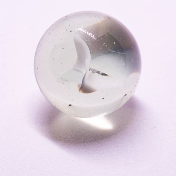 istock Macro closeup of white marble in white background studio shot 1277299418