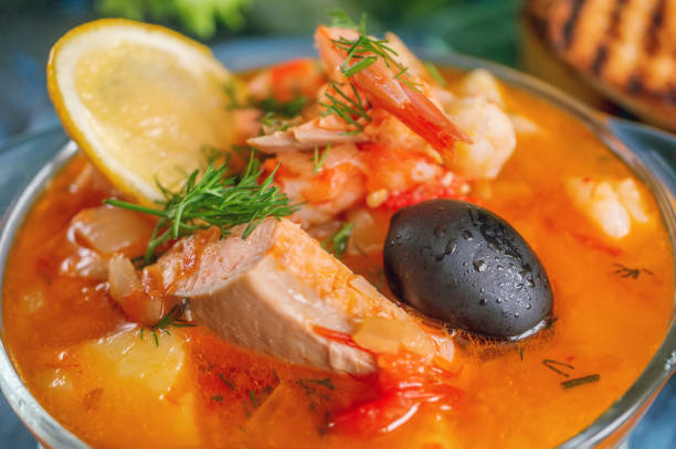 istock Seafood, salmon and cod soup with potatoes. Served with lemon, olives and delicious white bread croutons. 1277299771