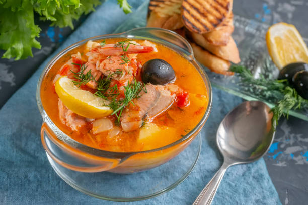 istock Seafood, salmon and cod soup with potatoes. Served with lemon, olives and delicious white bread croutons 1277299773