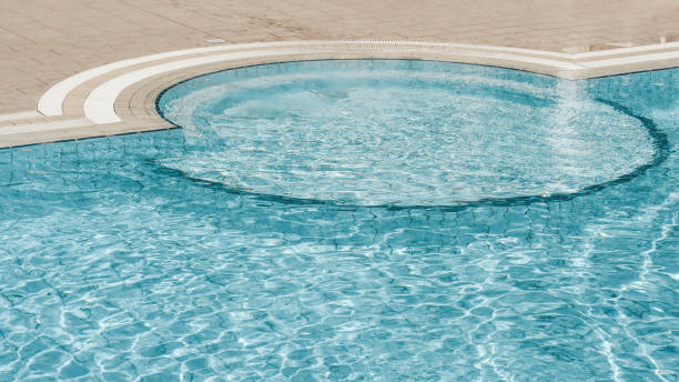 istock Beautiful refreshing clear blue water in the outdoor pool 1277299835