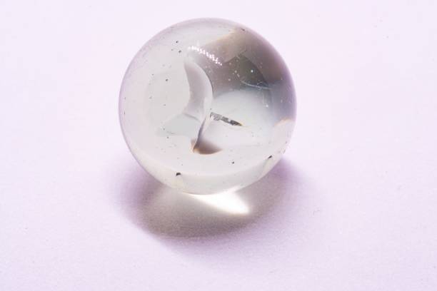 istock Macro closeup of white marble in white background studio shot 1277299956