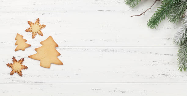 istock Christmas card with tree and gingerbread cookies 1277300875