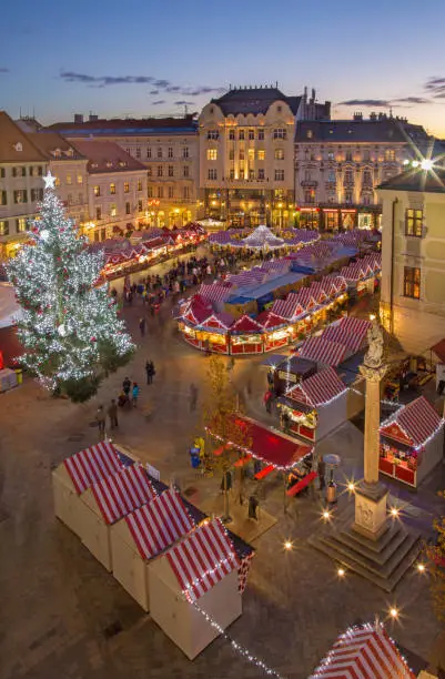 Photo of Bratislava - Christmas market on the Main square in evening dusk.