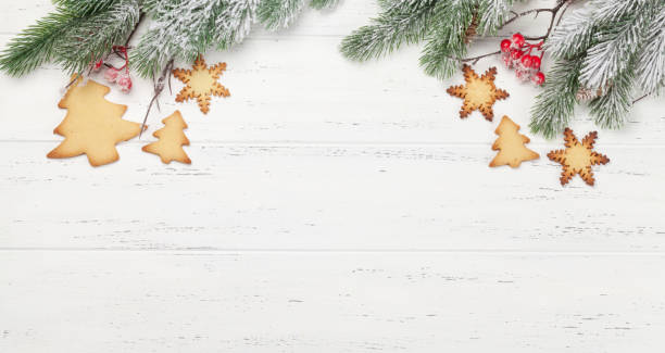 istock Christmas card with tree and gingerbread cookies 1277300975