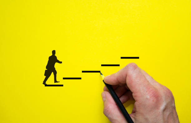 istock Conceptual image of personal vision, education and development. Beautiful yellow background, copy space. Businessman icon. 1277301075
