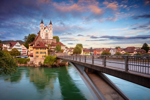 Aarburg, Switzerland. Cityscape image of beautiful city of Aarburg with the reflection of the city in the Aare river at sunset. aargau canton photos stock pictures, royalty-free photos & images