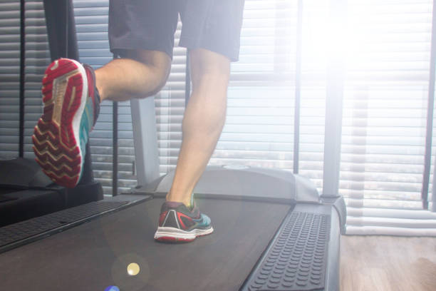 legs of a running man on a treadmill ripl fitness