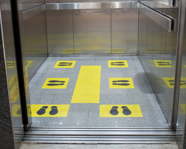 istock Marks for standing distance in passenger elevators To stand apart During the coronavirus outbreak. Concept of social distance 1277302695