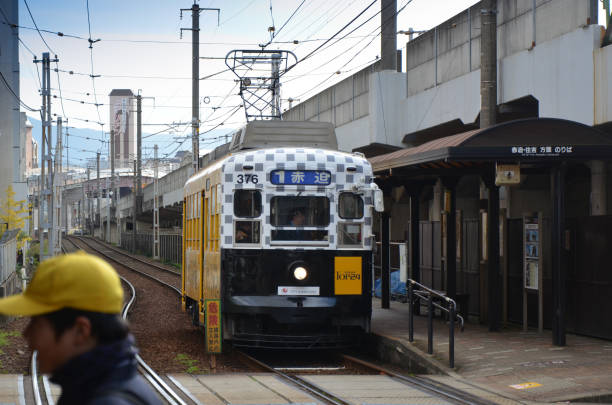Nagasaki, Japan, November 19, 2012 - Old cars of the Nagasaki streetcar on Kyushu Island. Line 1 travels from the north at Akasako (赤迫) via the main station to the south via Dejima to the east to Shōkakuji-shita (正覚寺下).