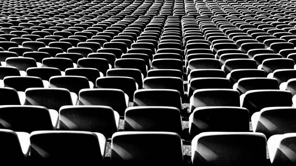 istock black and white view of endless rows of empty chairs in a stadium 1277306199