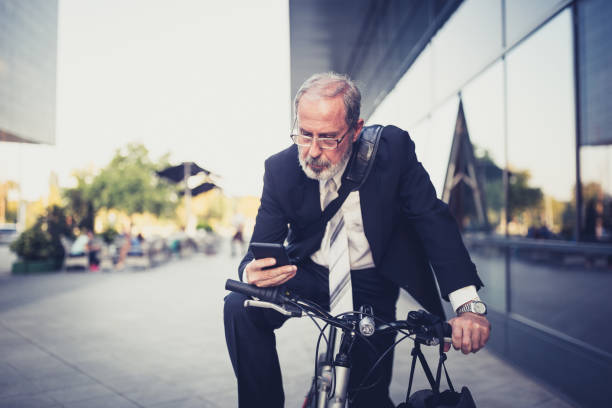 istock Active senior businessman texting in front of the office building 1277306650