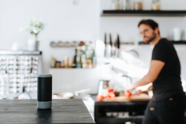 istock Adult man asks cooking advice from smart speaker 1277308137