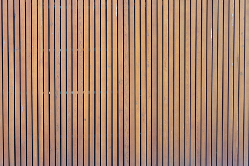 pattern of modern wall with vertical wooden panel, slats. background of wooden boards. wooden fence texture. wood plank with pattern for design and architecture