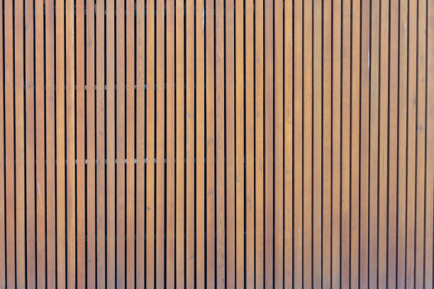 pattern of modern wall with vertical wooden panel, slats. background of wooden boards. wooden fence texture. wood plank with pattern for design stock photo