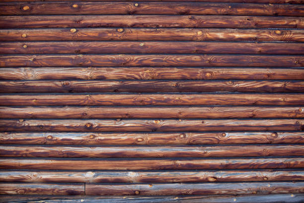 wooden wall of log house as background stock photo